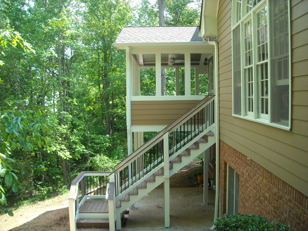 Inspiration for a mid-sized timeless back porch remodel in Atlanta with decking and a roof extension