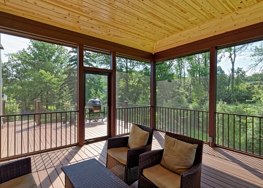 Inspiration for a huge timeless screened-in back porch remodel in DC Metro with decking and a roof extension