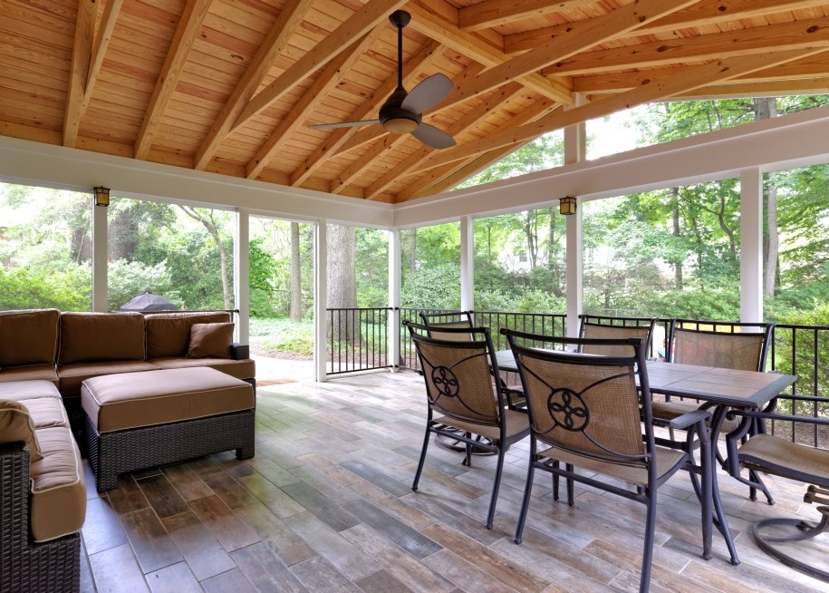 Large elegant tile screened-in back porch photo in DC Metro with a roof extension