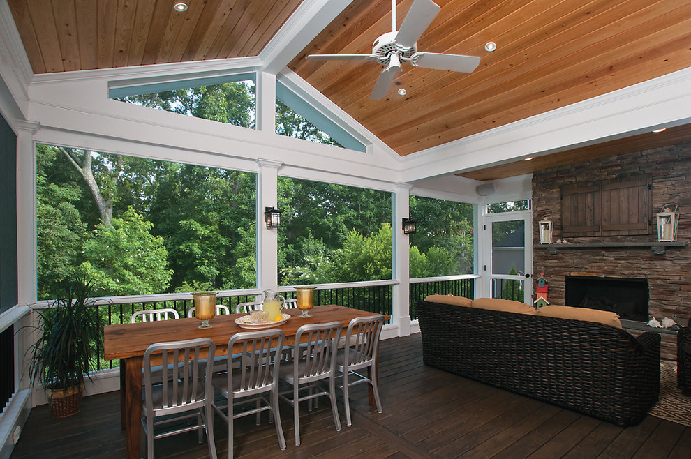 Inspiration for a large transitional back porch remodel in Atlanta with a roof extension