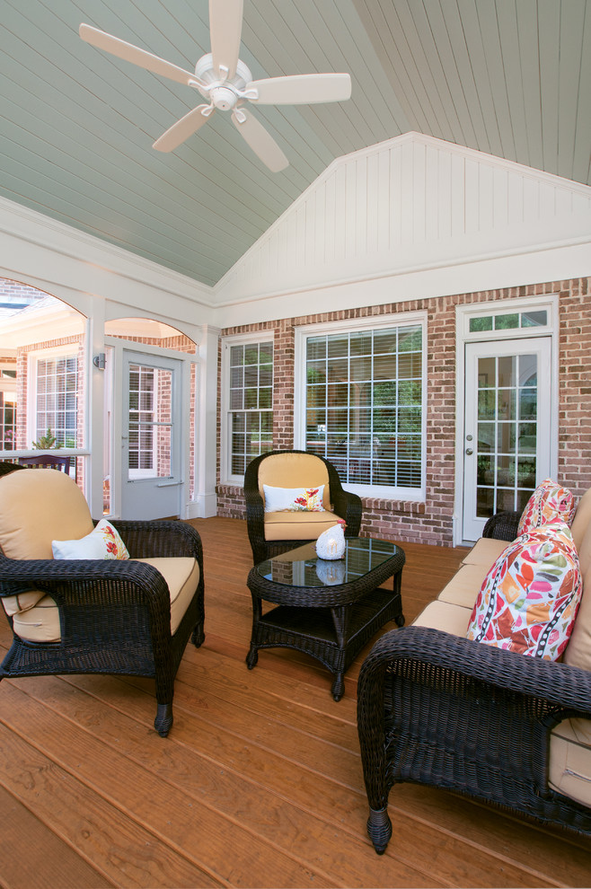 Photo of a medium sized classic back veranda in Atlanta with a roof extension.