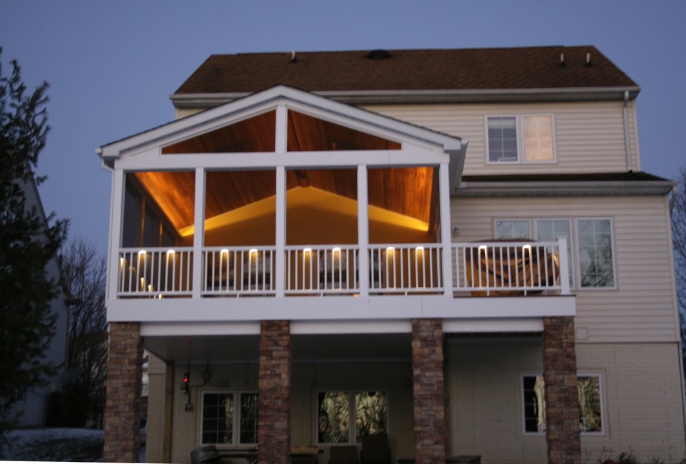 Photo of a medium sized contemporary back screened veranda in Baltimore with decking and a roof extension.