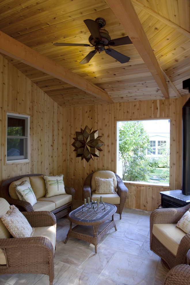 This is an example of a traditional porch design in Milwaukee with a roof extension.