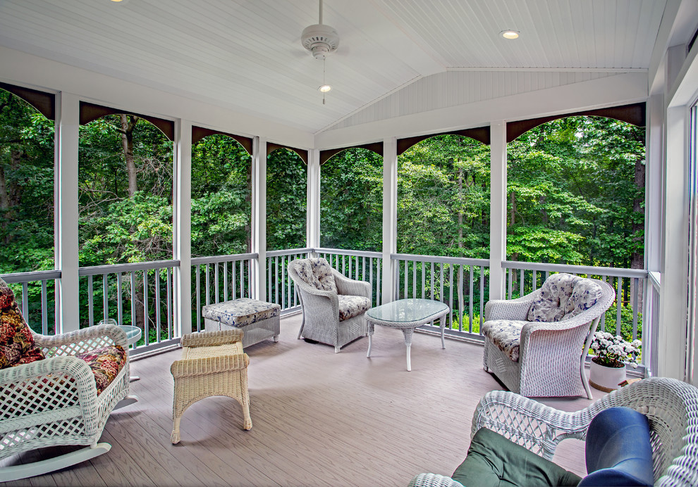 Inspiration for a mid-sized timeless concrete paver screened-in back porch remodel in DC Metro with a roof extension
