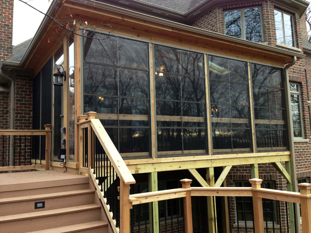 Design ideas for a large rustic screened veranda in Chicago with decking and a roof extension.