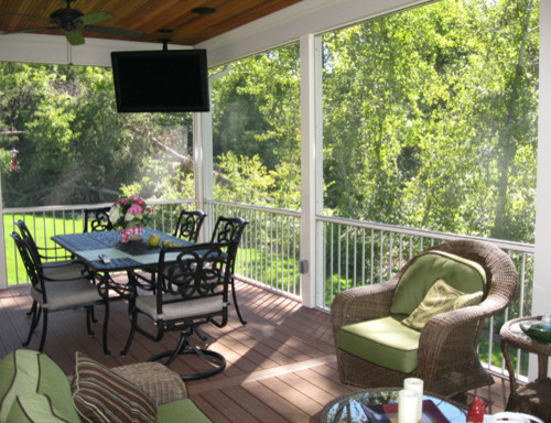 Inspiration for a medium sized classic back screened veranda in St Louis with decking and a roof extension.