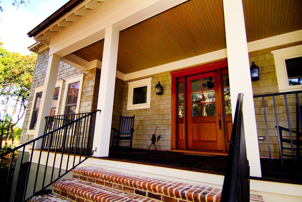 Mid-sized transitional metal railing front porch photo in Charleston with decking and a roof extension