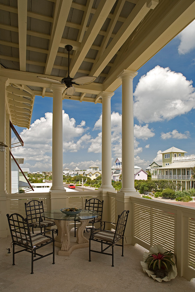 Photo of a coastal veranda in Miami with a roof extension.
