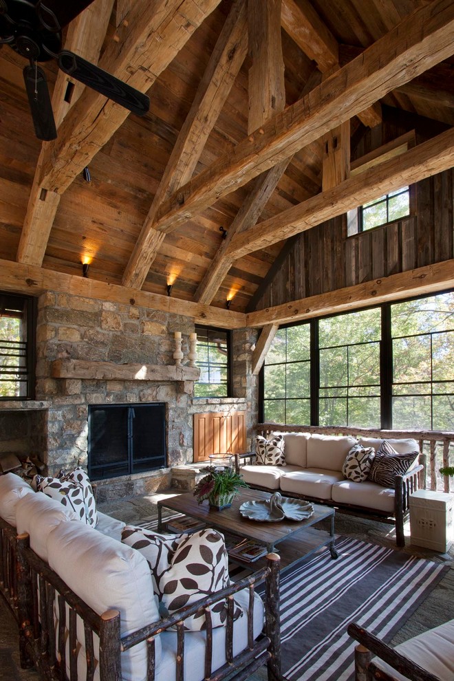 Mountain style porch idea in Other with a roof extension
