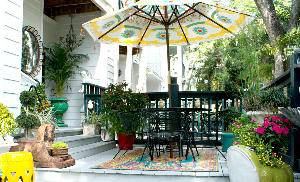 This is an example of an asian porch design in Tampa.