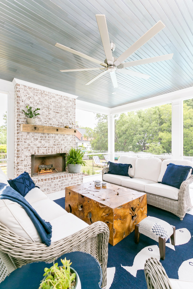 Large beach style screened-in back porch photo in Charleston with a roof extension
