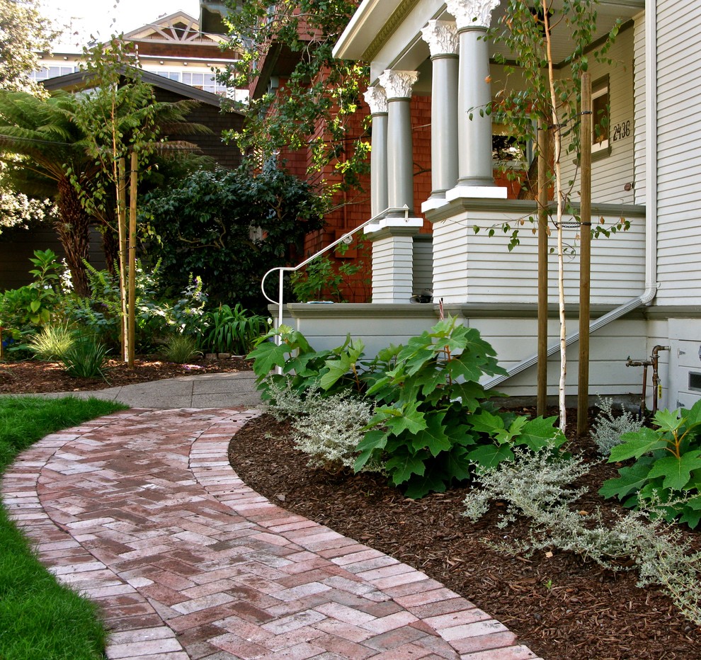 This is an example of a mid-sized contemporary front porch design in San Francisco.