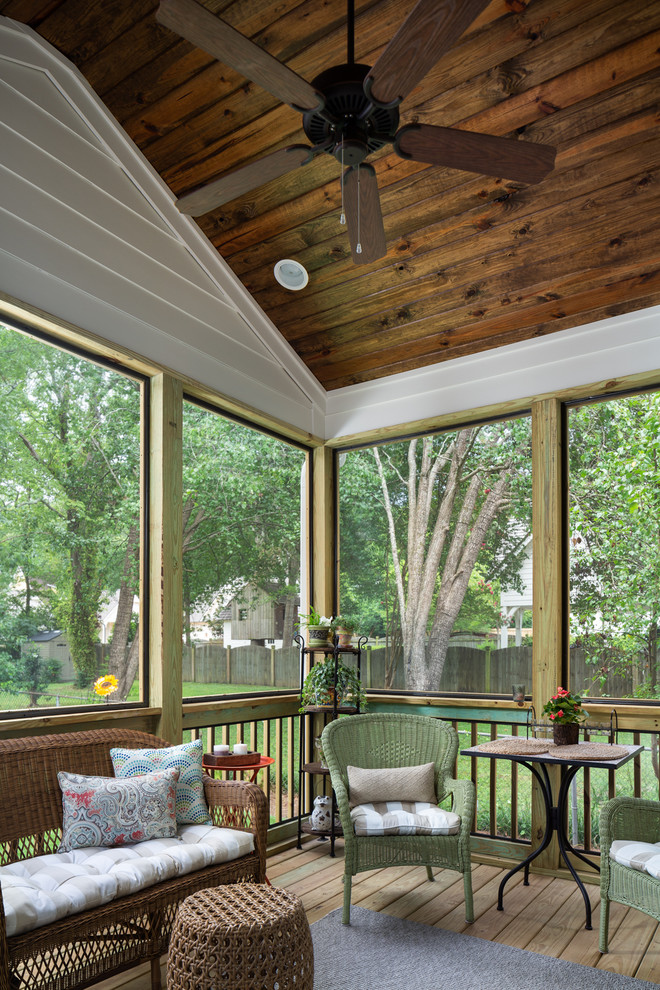 Inspiration for a small timeless screened-in back porch remodel in Birmingham with a roof extension