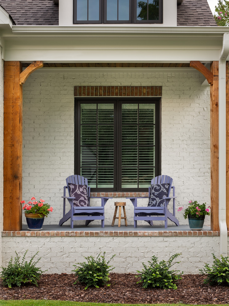 Small classic front porch idea in Birmingham with a roof extension