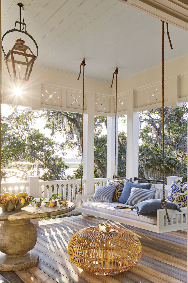 Inspiration for a coastal porch remodel in Jacksonville with decking and a roof extension
