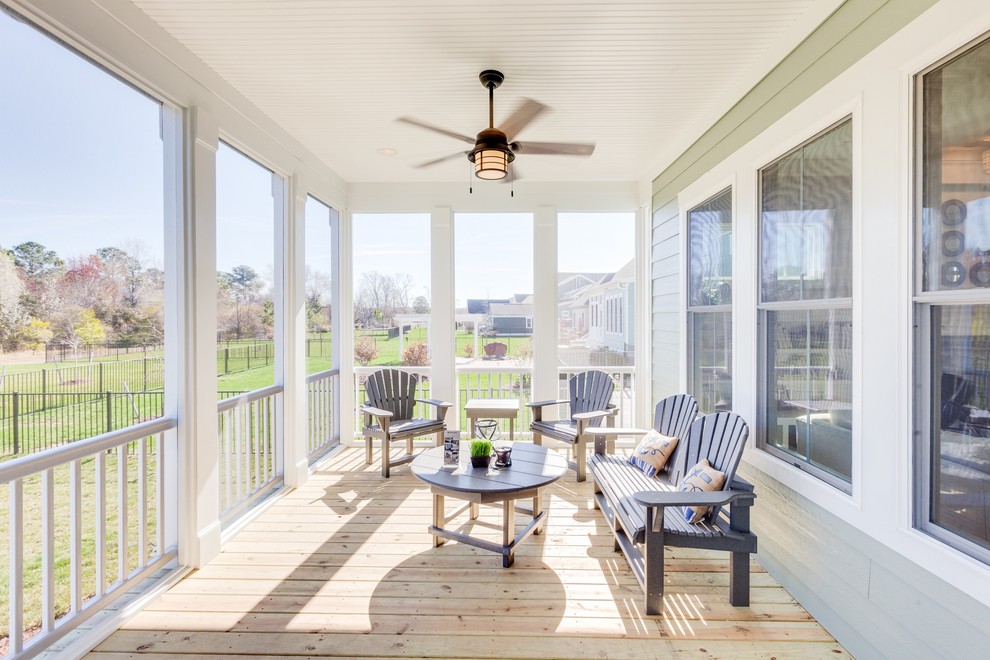 Mid-sized beach style back porch photo in Other with a roof extension