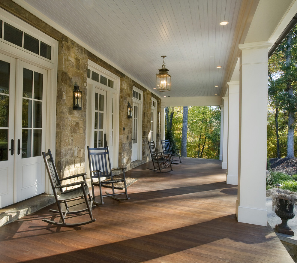 Inspiration for a large timeless front porch remodel in Nashville with decking and a roof extension