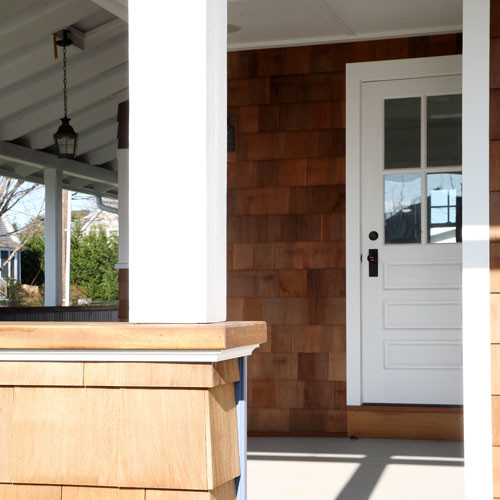 Inspiration for a mid-sized coastal front porch remodel in Bridgeport with decking and a roof extension