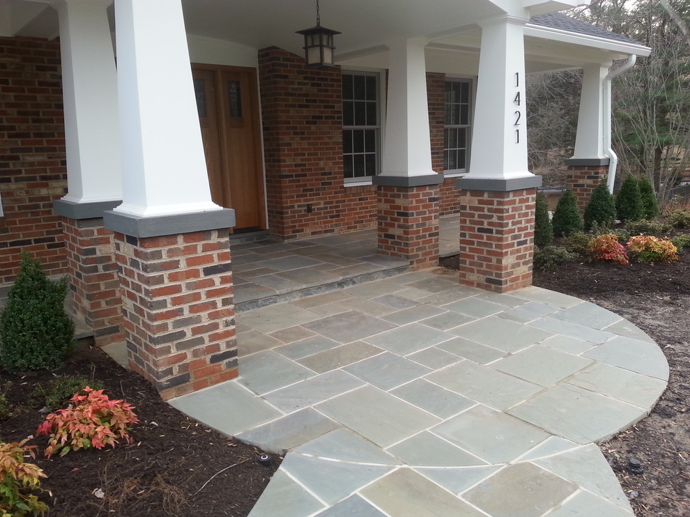 Inspiration for a mid-sized timeless tile front porch remodel in DC Metro with a roof extension