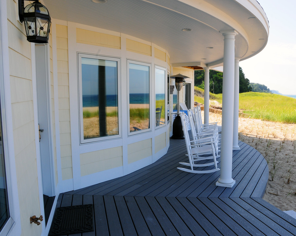 Photo of a large nautical back veranda in Other with decking and a roof extension.