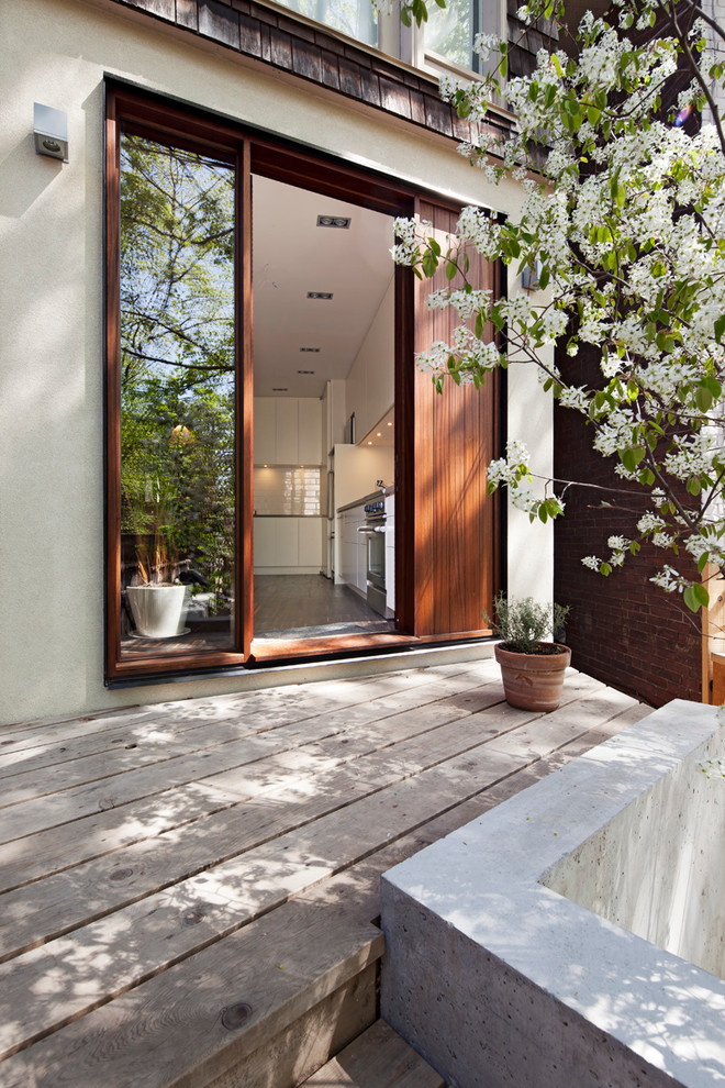 Design ideas for a small contemporary veranda in Toronto with decking.