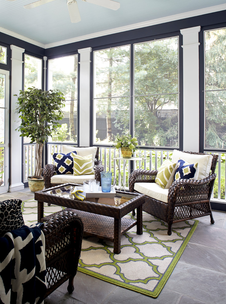 Elegant screened-in porch photo in New York with a roof extension
