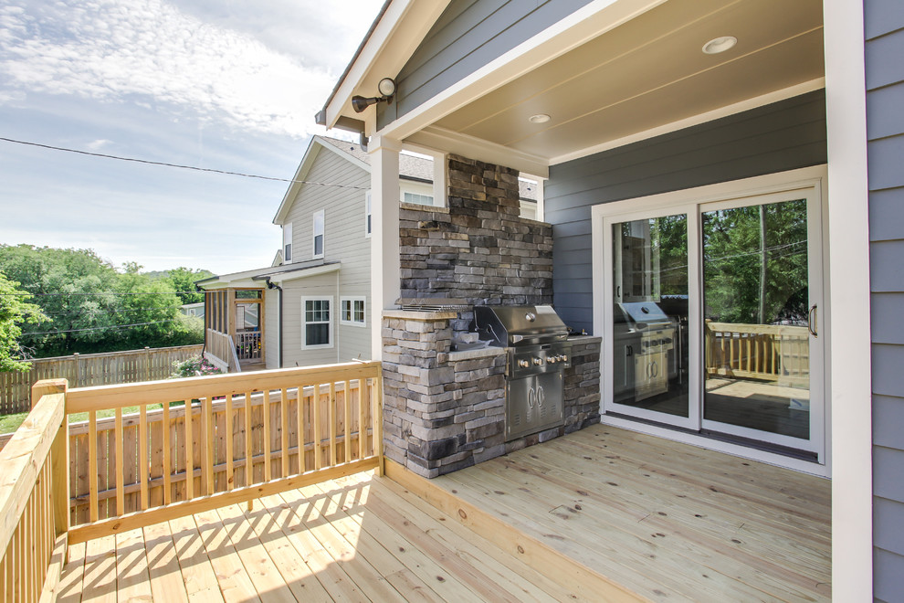 Idées déco pour un porche d'entrée de maison arrière campagne de taille moyenne avec une cuisine d'été, une terrasse en bois et une extension de toiture.