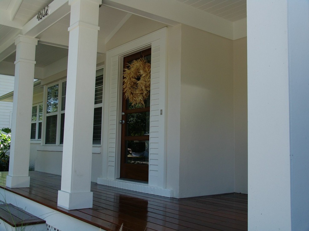 This is an example of a tropical porch design in Tampa.
