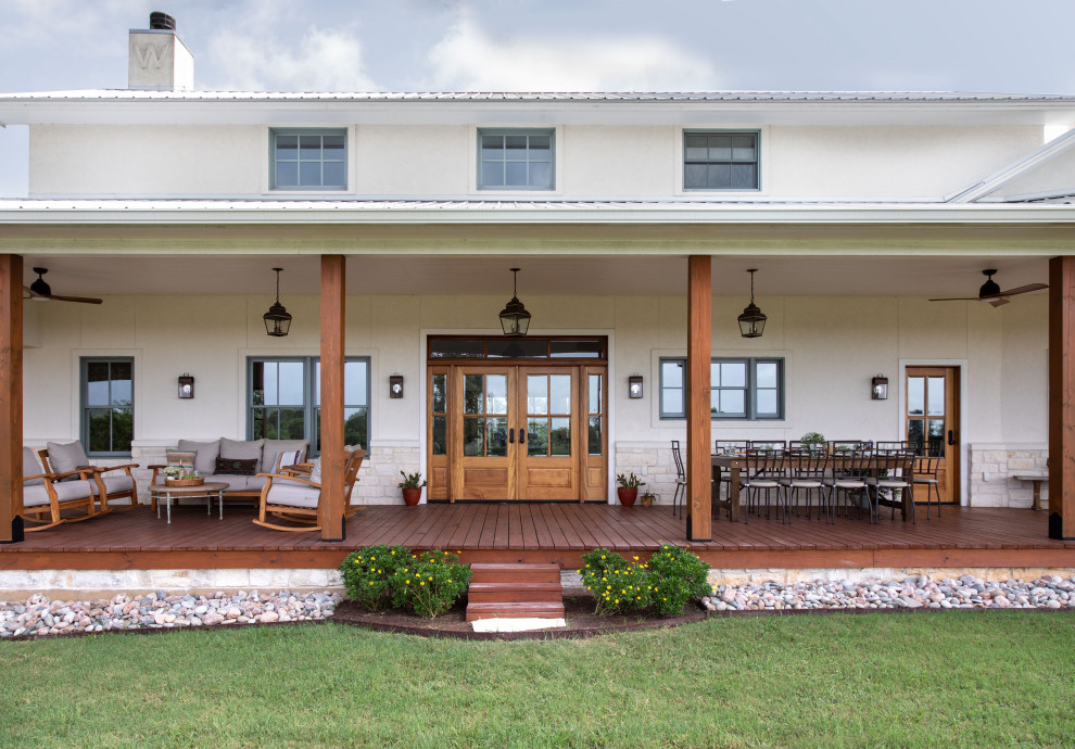 This is an example of a transitional porch design in Houston.