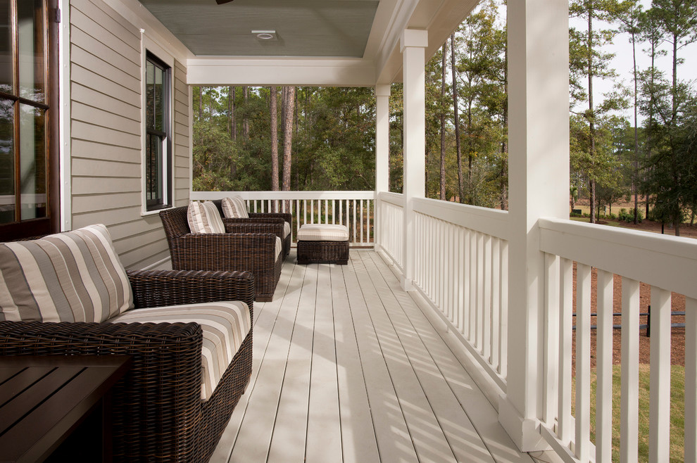 Photo of a large classic front veranda in Charleston with decking and a roof extension.
