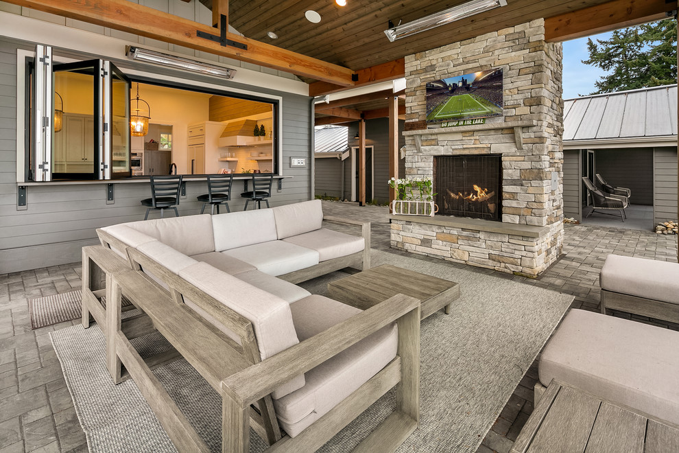 Inspiration for a beach style veranda in Seattle with a roof extension and a bar area.