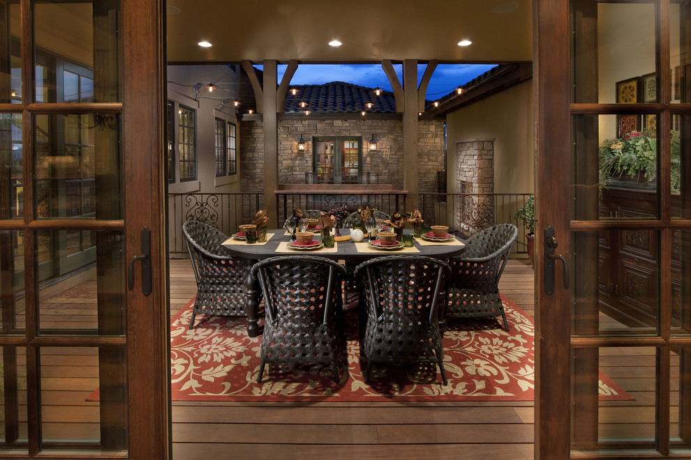 This is an example of a mediterranean porch design in Denver.