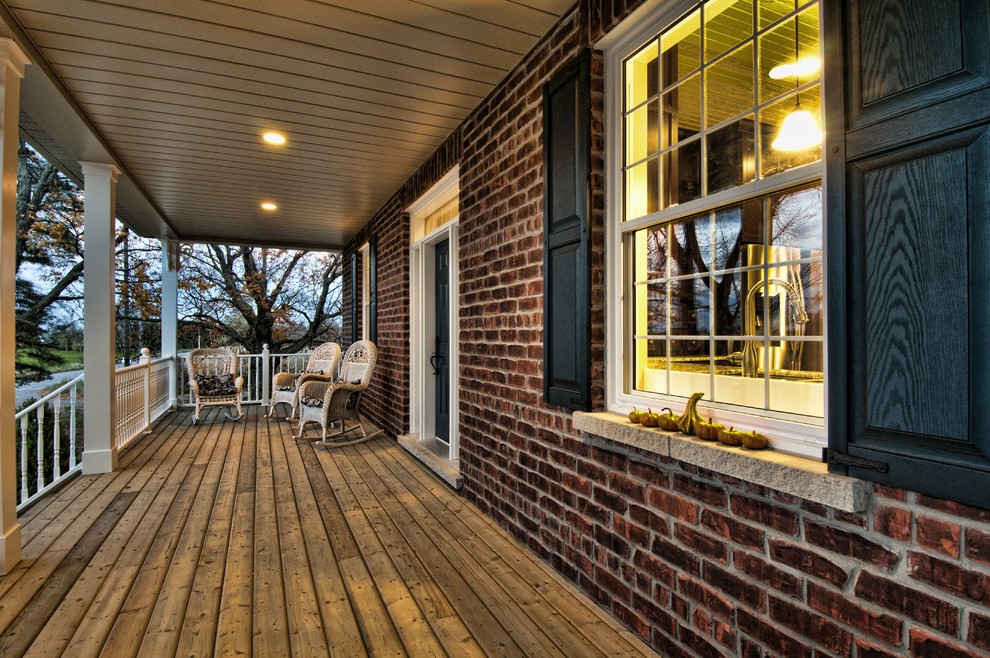 Inspiration for a large timeless front porch remodel in Toronto with decking and a roof extension