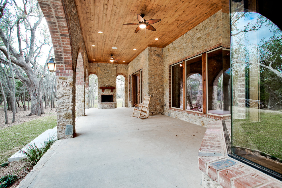 Classic veranda in Dallas with a fire feature and a roof extension.