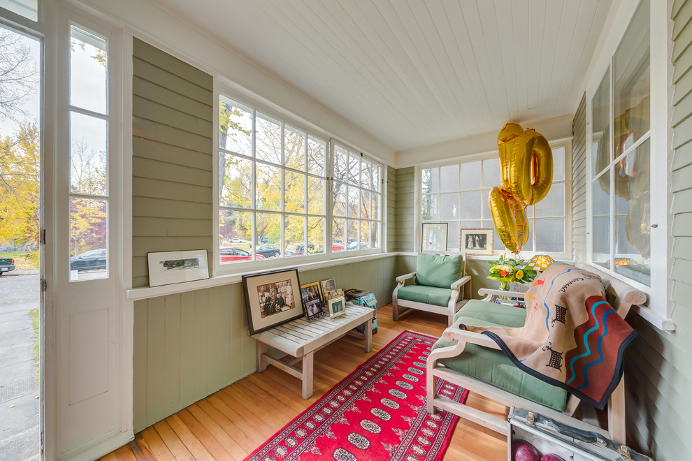 This fantastic enclosed porch can't you see a nap on that couch being