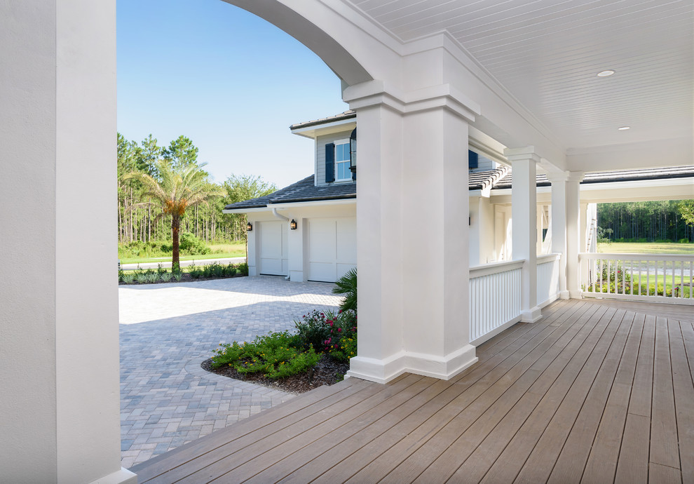 Mid-sized beach style front porch photo in Jacksonville with decking and a roof extension