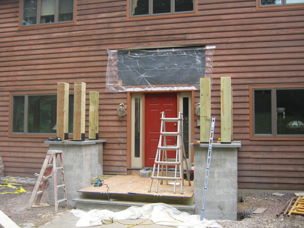Cette photo montre un porche d'entrée de maison éclectique.