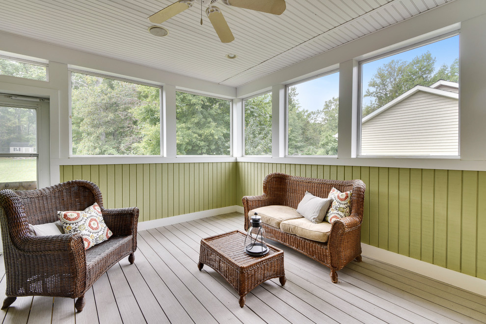 Large elegant screened-in back porch photo in Baltimore with decking and a roof extension