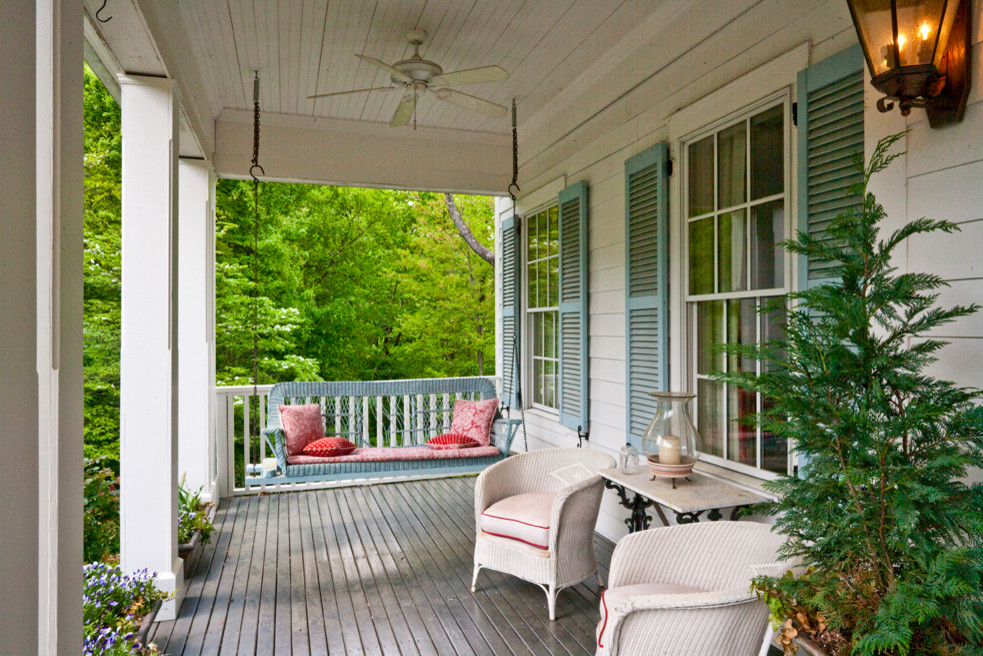 Inspiration for a country front porch remodel in Other with decking and a roof extension