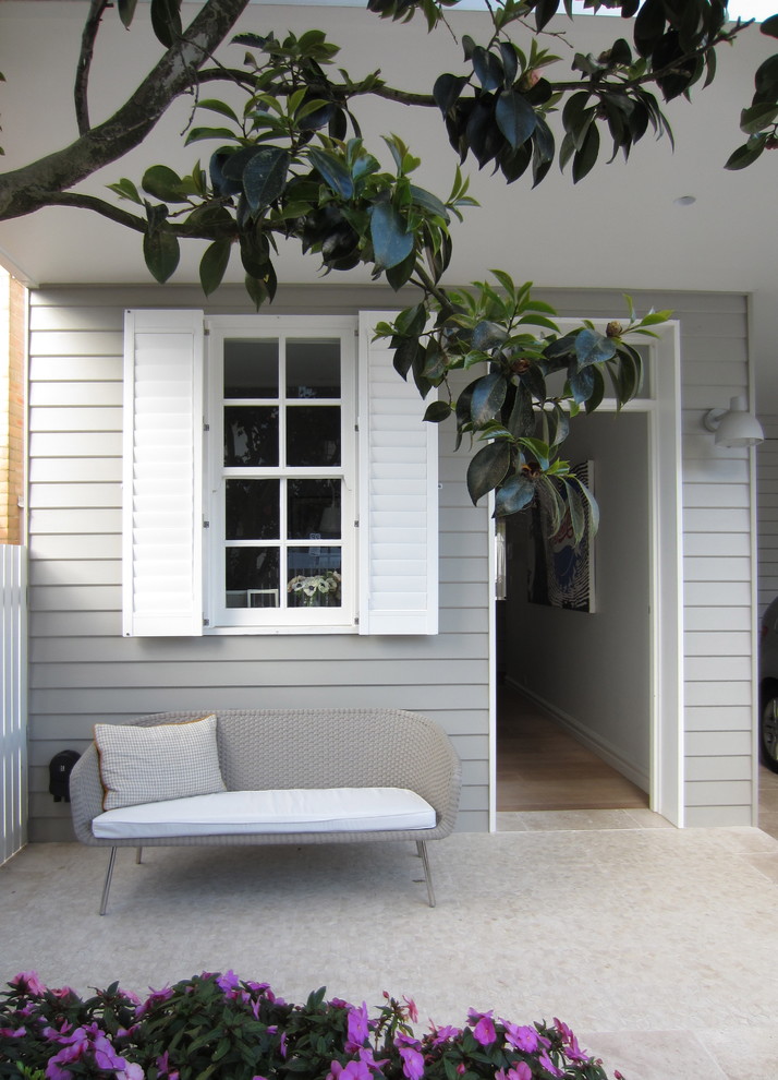 Inspiration för en vintage veranda, med takförlängning
