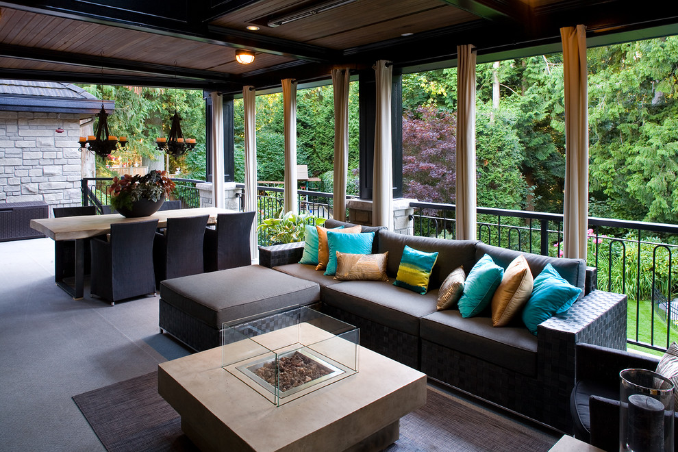 Photo of a traditional veranda in Vancouver with a roof extension.