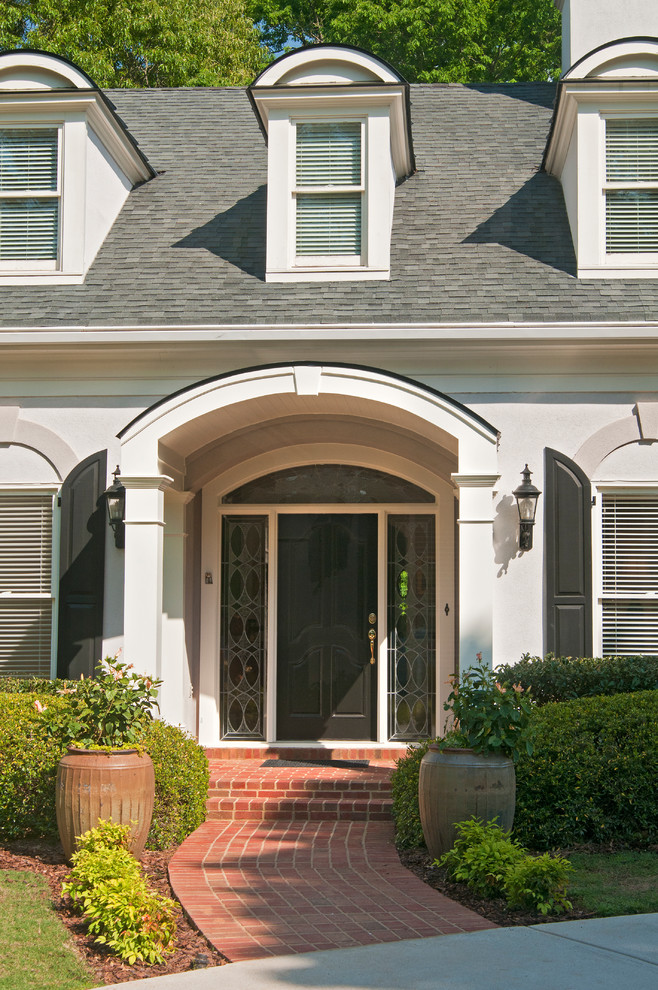 Two column arched portico with gable roof located in Marietta, GA