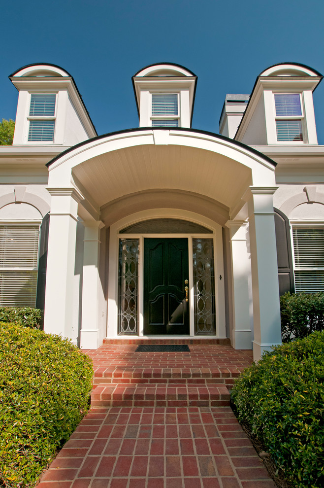 Two column arched portico with gable roof located in Marietta, GA