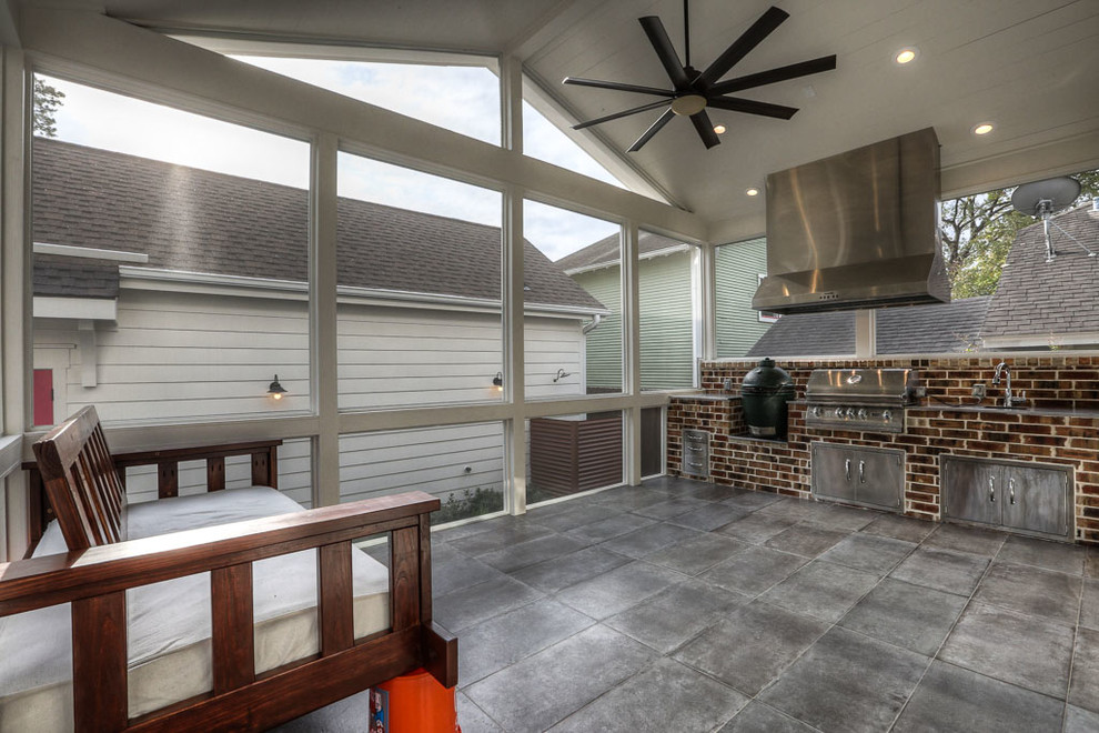 Large farmhouse concrete paver screened-in back porch idea in Houston with a roof extension