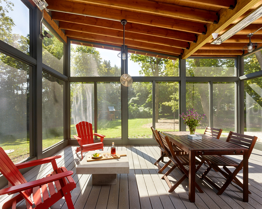 Photo of a medium sized contemporary back screened veranda in Philadelphia with decking and a roof extension.