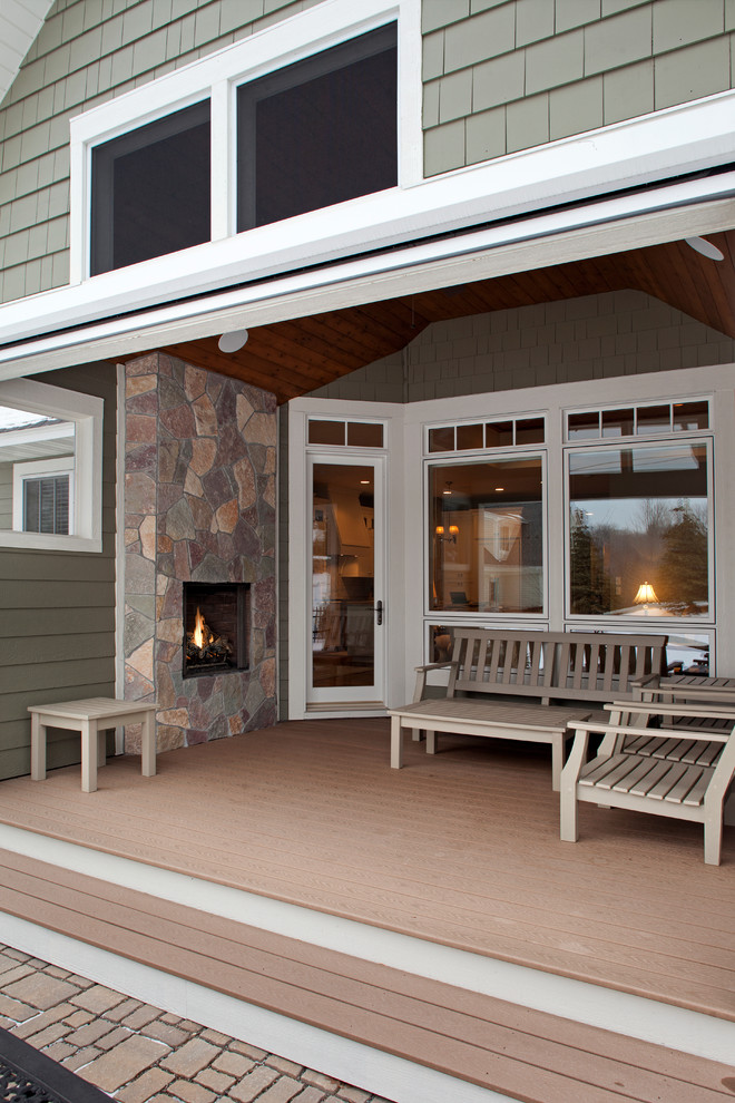 Inspiration for a medium sized classic back screened veranda in Minneapolis with decking and a roof extension.