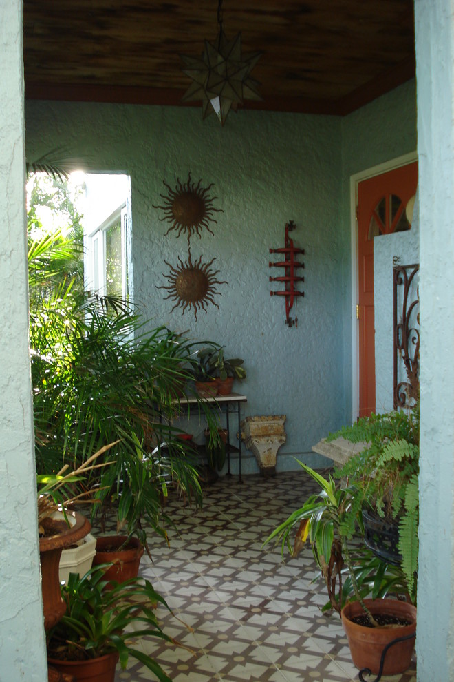 Island style porch photo in Miami