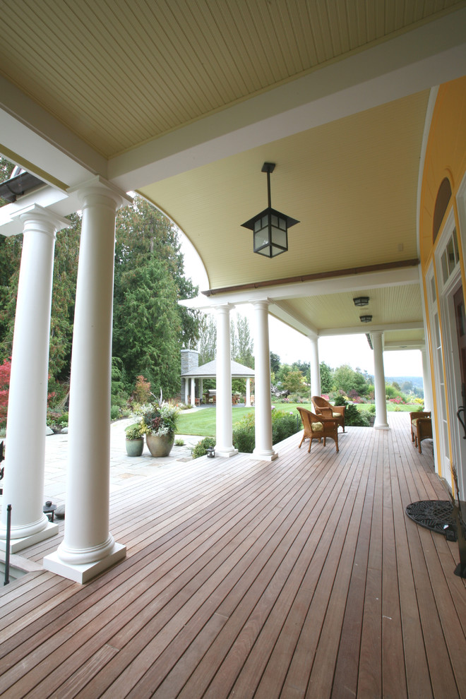 Inspiration for a large classic front veranda in Seattle with decking and a roof extension.