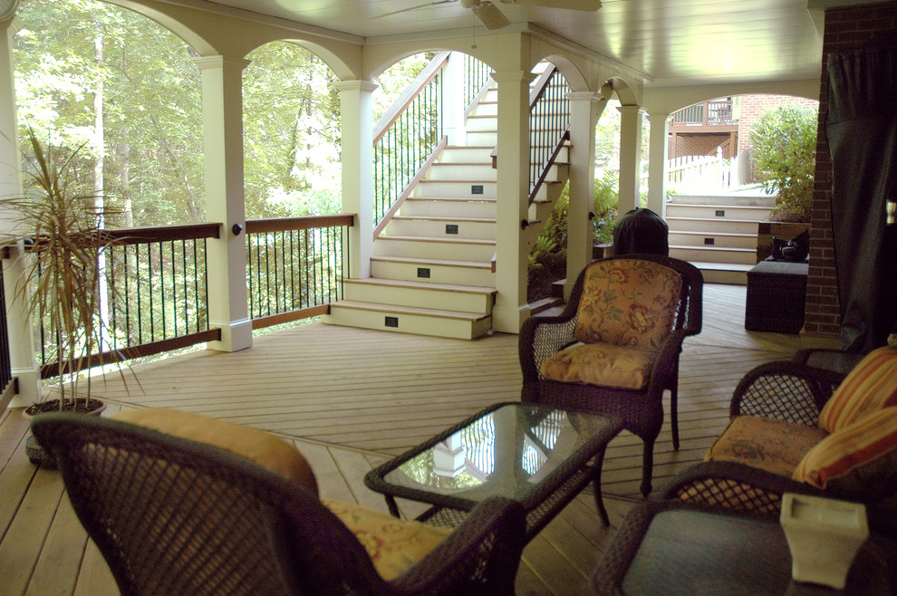 This is an example of a traditional back veranda in Atlanta with a roof extension.