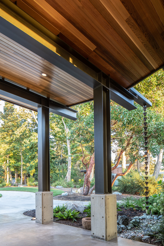 Mittelgroßes, Überdachtes Modernes Veranda im Vorgarten mit Betonplatten in Seattle